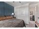 Well-lit bedroom featuring a closet and adjacent bathroom at 10029 E Wavelength Ave, Mesa, AZ 85212