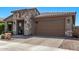 Delightful single-story home with stone accents, a two-car garage, and low-maintenance desert landscaping at 10029 E Wavelength Ave, Mesa, AZ 85212