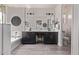 Elegant main bathroom featuring double sinks, dark cabinetry, and modern fixtures at 10029 E Wavelength Ave, Mesa, AZ 85212