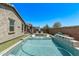 Stunning pool with water feature and poolside loungers, perfect for outdoor entertaining at 10029 E Wavelength Ave, Mesa, AZ 85212