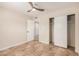 Bedroom featuring tile flooring, large closet and neutral color scheme at 10244 N 65Th Ln, Glendale, AZ 85302