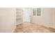 Bright bedroom featuring tile flooring, closet and a shuttered window at 10244 N 65Th Ln, Glendale, AZ 85302