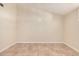 Empty bedroom with tile flooring and neutral wall paint at 10244 N 65Th Ln, Glendale, AZ 85302