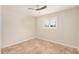 Bright bedroom featuring tile flooring, ceiling fan and a shuttered window at 10244 N 65Th Ln, Glendale, AZ 85302