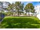 Community park featuring lush green grass, mature shade trees, and surrounding homes, perfect for outdoor activities at 10244 N 65Th Ln, Glendale, AZ 85302