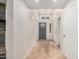 Neutral entryway featuring tile flooring and a gray front door at 10244 N 65Th Ln, Glendale, AZ 85302