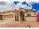 Charming desert home featuring low-maintenance landscaping, attached garage, and gated front entryway at 10244 N 65Th Ln, Glendale, AZ 85302