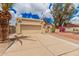 The home features a two car garage and charming desert landscaping at 10244 N 65Th Ln, Glendale, AZ 85302