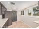 Kitchen features gray cabinets, light countertops, and natural light from the windows at 10244 N 65Th Ln, Glendale, AZ 85302