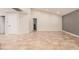 Spacious living room featuring tile floors, neutral walls, and ample natural light at 10244 N 65Th Ln, Glendale, AZ 85302