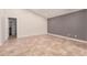 Bright living room featuring tile flooring and light gray accent wall at 10244 N 65Th Ln, Glendale, AZ 85302