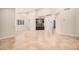 Spacious living room features tile flooring and a stone accent wall with built-ins at 10244 N 65Th Ln, Glendale, AZ 85302