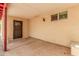 Covered patio featuring concrete flooring, and metal security door at 10244 N 65Th Ln, Glendale, AZ 85302