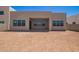 Expansive backyard, showcasing the home's modern architecture with large windows, ready for landscaping and outdoor enjoyment at 10332 E Utah Ave, Mesa, AZ 85212