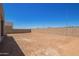 Large backyard enclosed by a block wall, offering privacy and ample space for outdoor activities and landscaping projects at 10332 E Utah Ave, Mesa, AZ 85212