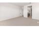 Spacious bedroom with plush carpet leading to an ensuite bathroom and walk-in closet at 10332 E Utah Ave, Mesa, AZ 85212