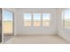 Bright sunroom featuring tile floors with multiple windows at 10332 E Utah Ave, Mesa, AZ 85212