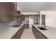 Well-equipped kitchen with stainless steel appliances, granite countertops, and ample cabinet space at 10332 E Utah Ave, Mesa, AZ 85212