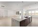 Bright, open-concept kitchen with a large island, modern appliances, and plenty of counter space at 10332 E Utah Ave, Mesa, AZ 85212