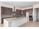 Stylish kitchen featuring stainless steel appliances, sleek cabinetry, and a spacious central island at 10332 E Utah Ave, Mesa, AZ 85212