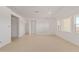 Bright, open living room area with tile flooring, recessed lighting, and multiple windows at 10332 E Utah Ave, Mesa, AZ 85212