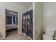 En-suite bathroom with neutral paint, tile flooring, and access to a bedroom featuring a large window at 11156 E Lost Canyon Ct, Gold Canyon, AZ 85118