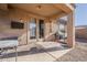 Covered patio featuring a built-in BBQ, perfect for outdoor dining and entertaining at 11156 E Lost Canyon Ct, Gold Canyon, AZ 85118