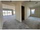 Living room and open floor plan view with windows and door to exterior at 11416 E Utah Ave, Mesa, AZ 85212