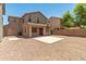Backyard features a patio area, gravel landscaping, privacy fence and desert landscaping at 11834 N 147Th Ln, Surprise, AZ 85379
