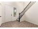 A home's inviting entryway featuring a staircase and natural light streaming through a window at 11834 N 147Th Ln, Surprise, AZ 85379
