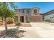 Two-story home with desert landscaping, covered entry, and two car garage at 11834 N 147Th Ln, Surprise, AZ 85379