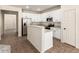 Modern kitchen boasting stainless steel appliances, ample counter space, and an open layout at 11834 N 147Th Ln, Surprise, AZ 85379