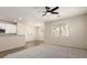 Open-concept living room offering natural light, neutral walls, and plush carpeting at 11834 N 147Th Ln, Surprise, AZ 85379
