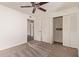 Bedroom with neutral-colored carpet, white walls, and a closet with bifold doors at 129 Leisure World --, Mesa, AZ 85206