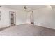 Bright bedroom with white walls, neutral carpet, and an open closet space at 129 Leisure World --, Mesa, AZ 85206