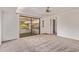 Bedroom featuring neutral-colored carpet, white walls, and sliding glass doors to the outside at 129 Leisure World --, Mesa, AZ 85206