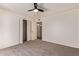 Bedroom featuring neutral-colored carpet, closet with bifold doors, and neutral paint at 129 Leisure World --, Mesa, AZ 85206