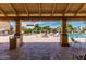 Inviting community pool area with lounge chairs and umbrellas, ideal for relaxation and social gatherings at 129 Leisure World --, Mesa, AZ 85206