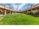 Beautiful courtyard with manicured lawn and fountain, creating a serene and inviting outdoor space at 129 Leisure World --, Mesa, AZ 85206