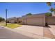 Charming home exterior featuring well-maintained landscaping, attached garages, and inviting curb appeal at 129 Leisure World --, Mesa, AZ 85206