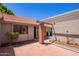 Inviting front entrance with brick accents and a shaded pergola at 129 Leisure World --, Mesa, AZ 85206