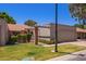View of front of home with lush green landscaping and architectural details at 129 Leisure World --, Mesa, AZ 85206