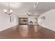 Bright, open living room with hardwood floors and sliding glass door to the patio at 129 Leisure World --, Mesa, AZ 85206