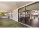A covered patio with sliding glass doors leading to the interior showcases indoor-outdoor living at 129 Leisure World --, Mesa, AZ 85206