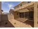 Inviting backyard patio with a pergola, creating a comfortable outdoor living space at 13473 N 158Th Ave, Surprise, AZ 85379