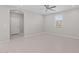 Neutral Primary bedroom with neutral walls, tile flooring, ceiling fan and closet at 13473 N 158Th Ave, Surprise, AZ 85379