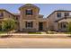 Attractive two-story home featuring a well-manicured lawn and appealing architectural details at 13473 N 158Th Ave, Surprise, AZ 85379