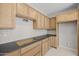 Spacious kitchen with natural wood cabinets, gray countertops, and white subway tile backsplash at 13473 N 158Th Ave, Surprise, AZ 85379