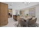 Elegant kitchen featuring stainless steel appliances and a dining area, with sliding glass doors to the backyard at 13473 N 158Th Ave, Surprise, AZ 85379