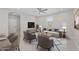 Inviting living room featuring contemporary decor, comfortable seating, and a stylish ceiling fan at 13473 N 158Th Ave, Surprise, AZ 85379